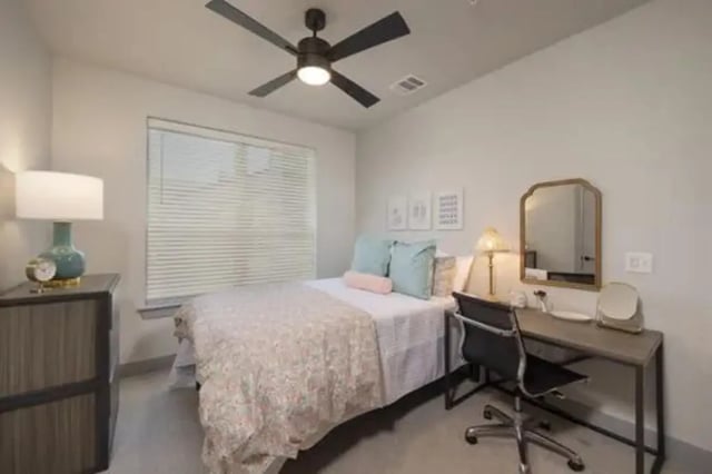 Bed desk lamp pillows mirror bedroom at The Wyatt in Lubbock Student Accommodation