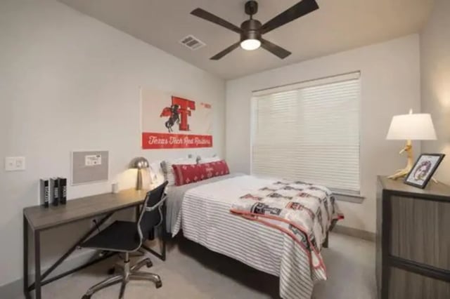 Desk bed and Texas Tech flag bedroom at The Wyatt in Lubbock Student Accommodation