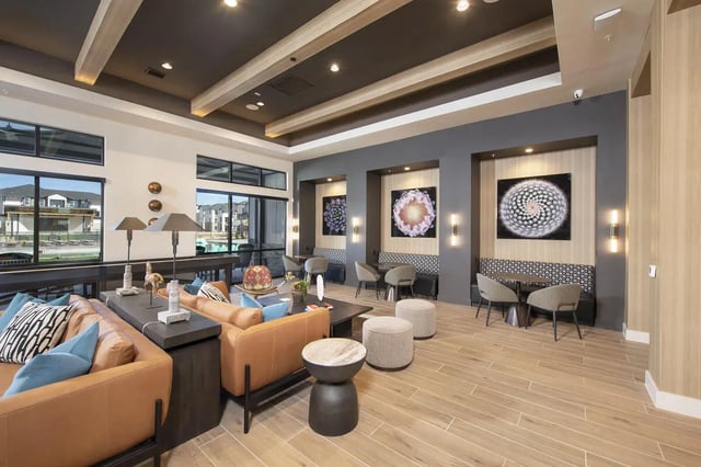 Comfortable sofas tables art and seating lounge area at The Wyatt in Lubbock Student Accommodation
