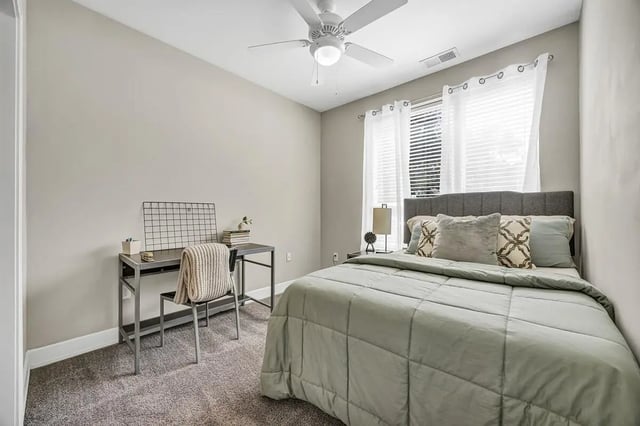 Bed desk chair and window Bedroom at Park Place Waco in Waco Student Accommodation