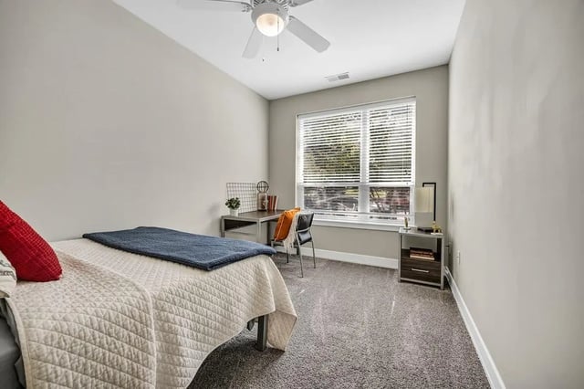 Bed desk chair and nightstand bedroom at Park Place Waco in Waco Student Accommodation