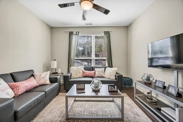 Leather sofas coffee table with decor living room at Park Place Waco in Waco Student Accommodation