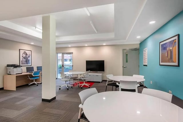 Computers printer tables and chairs common area at Social 28 in Gainesville Student Accommodation