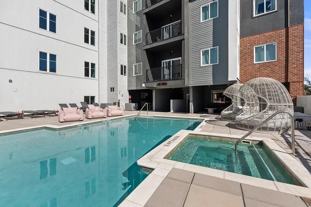 Pool hot tub lounge chairs exterior at Social 28 in Gainesville Student Accommodation