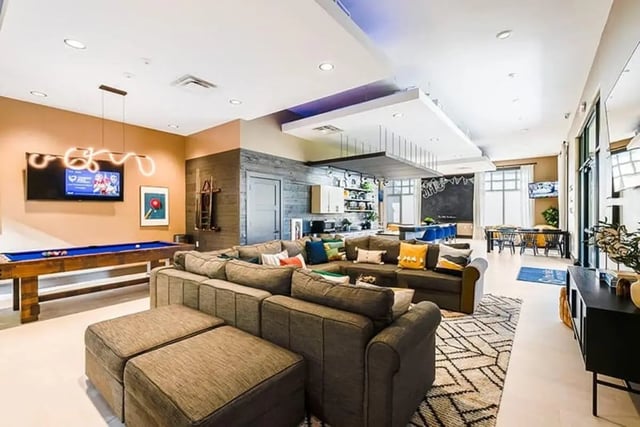 Pool table large sectional sofa living room at The Hills Northview Apartments in Harrisonburg Student Accommodation