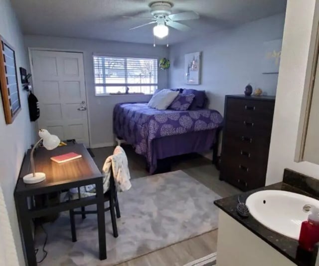 Desk bed dresser and sink bedroom at Capri Eugene Apartments in Eugene Student Accommodation