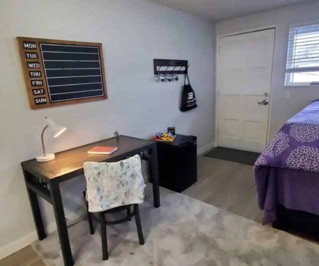 Desk lamp calendar keys bag mini fridge bed Bedroom at Capri Eugene Apartments in Eugene Student Accommodation