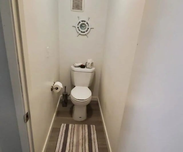 Toilet paper roll holder with tissue and clock Bathroom at Capri Eugene Apartments in Eugene Student Accommodation