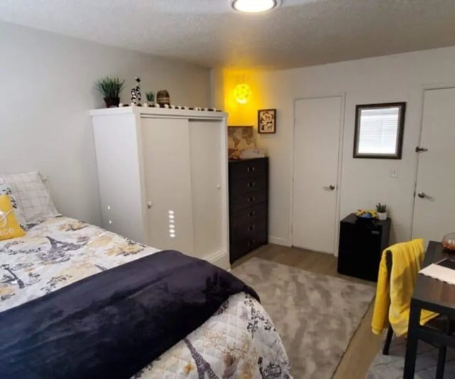 Bed wardrobe dresser rug and desk bedroom at Capri Eugene Apartments in Eugene Student Accommodation