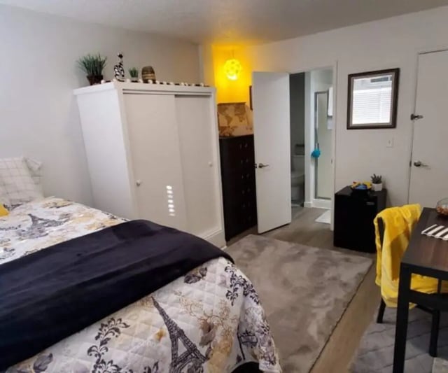 Bed wardrobe dresser rug bathroom bedroom interior at Capri Eugene Apartments in Eugene Student Accommodation