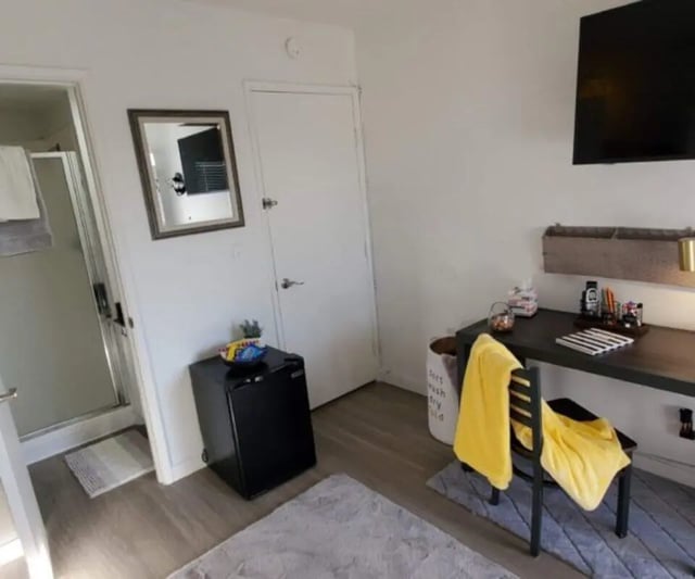Mini fridge desk mirror shower bedroom study area at Capri Eugene Apartments in Eugene Student Accommodation