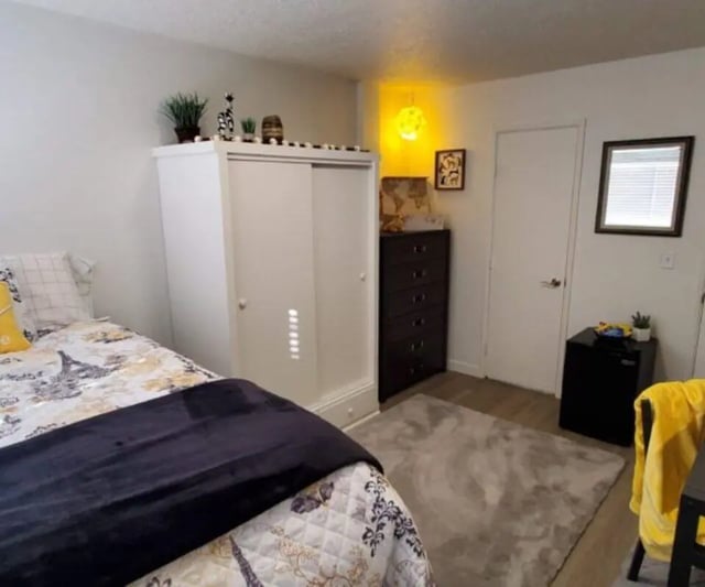Bed with closet dresser and rug bedroom at Capri Eugene Apartments in Eugene Student Accommodation