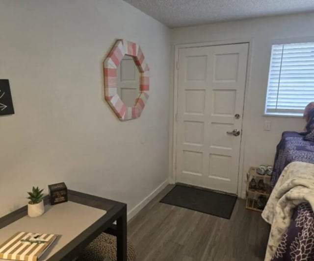 Desk mirror door and bed bedroom at Capri Eugene Apartments in Eugene Student Accommodation