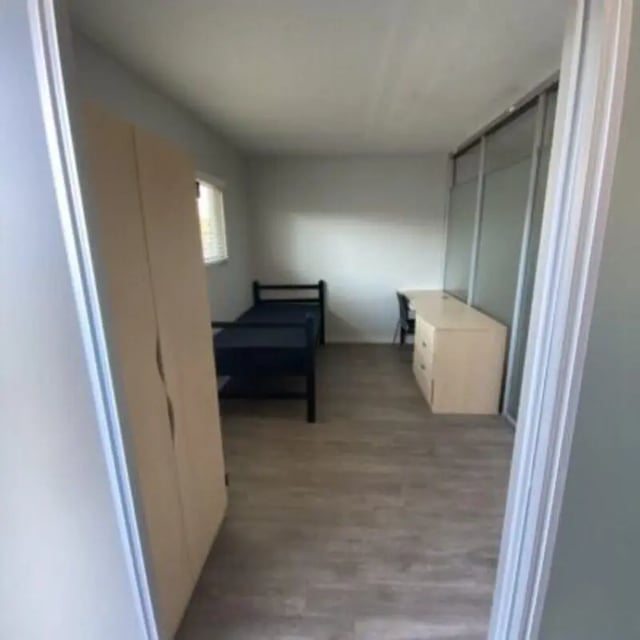 Bed desk wardrobe and closet student bedroom at Capri at Isla Vista Apartments in Isla Vista Student Accommodation