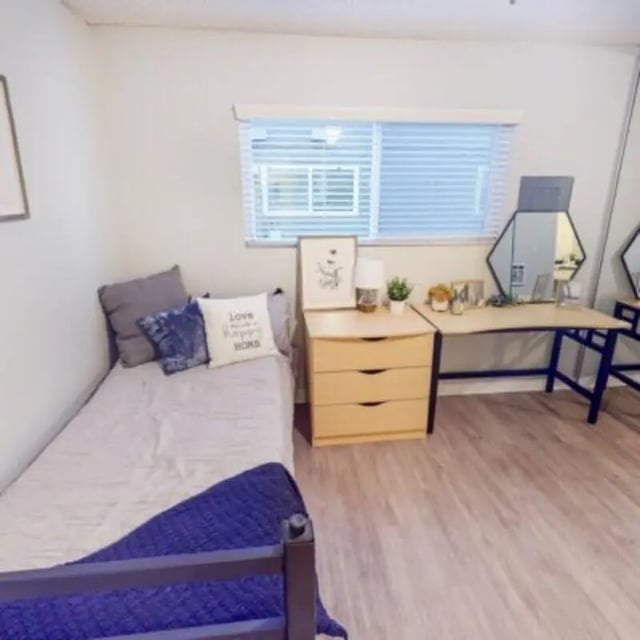 Bed dresser desk mirror bedroom at Capri at Isla Vista Apartments in Isla Vista Student Accommodation