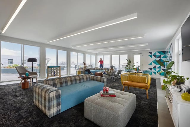 Sofa ottoman chairs connect four game living room at Stateside in Bellingham Student Accommodation