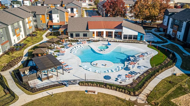 Resort-style pool with lounge chairs exterior at Aspen Heights Fayetteville in Fayetteville Student Accommodation