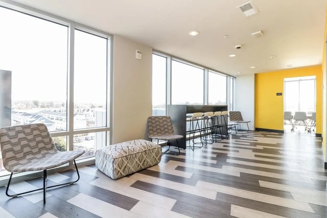 Chairs ottoman bar stools study area at Aspen Heights Towson in Towson Student Accommodation