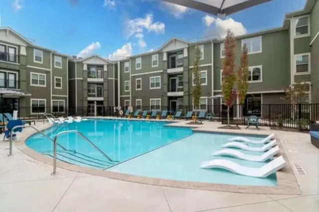 Swimming pool with lounge chairs exterior at 14 SixtyFive in Kennesaw Student Accommodation