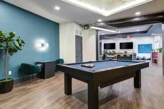 Pool table with balls and chairs playing area at 14 SixtyFive in Kennesaw Student Accommodation