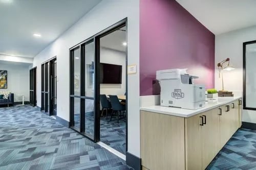 Printer on counter with purple wall common area at 14 SixtyFive in Kennesaw Student Accommodation