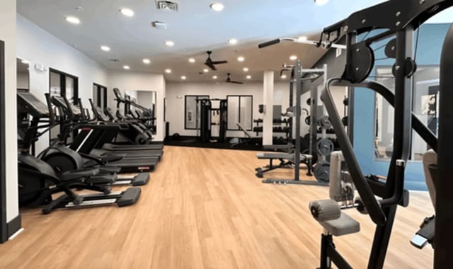 Treadmills ellipticals weight machines and dumbbells gym at 14 SixtyFive in Kennesaw Student Accommodation