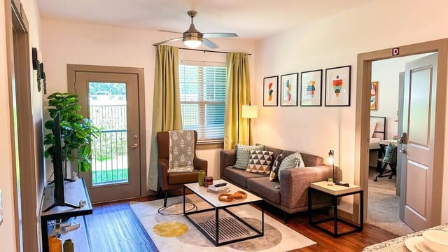 Sofa coffee table and artwork living room at 14 SixtyFive in Kennesaw Student Accommodation