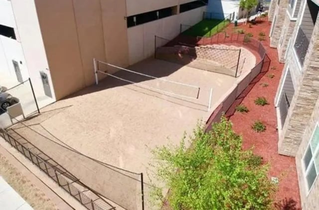 Volleyball court with sand and netting playing area at Aspen Springfield in Springfield Student Accommodation