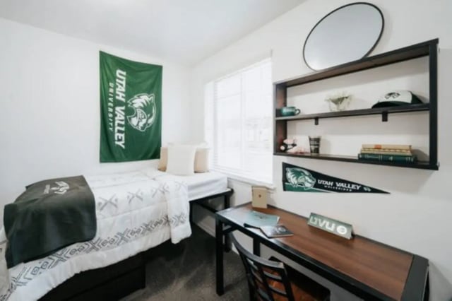 Bed desk shelf and mirror bedroom at Alpine Village in Provo Student Accommodation