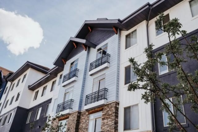 Balconies and windows on a multi-story exterior building exterior at Alpine Village in Provo Student Accommodation