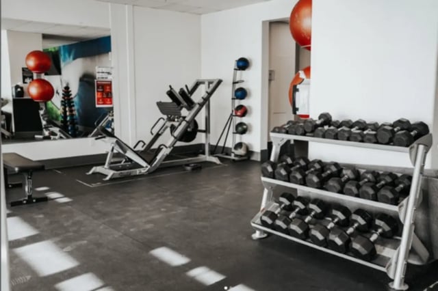 Dumbbells weight machine and exercise balls gym at Alpine Village in Provo Student Accommodation