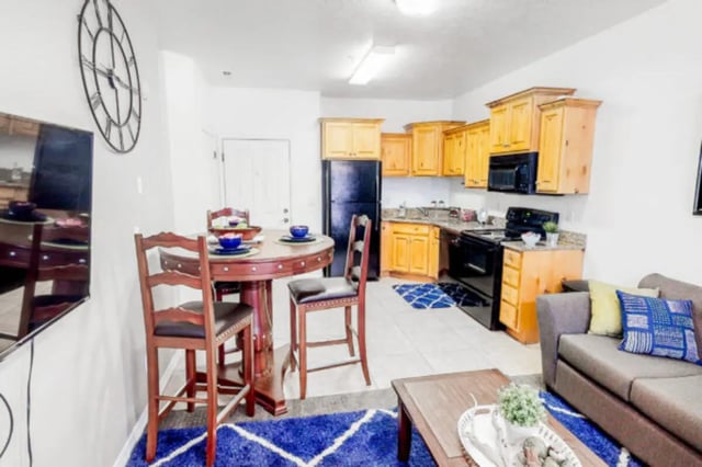 Dining table kitchen and living area. at Alpine Village in Provo Student Accommodation