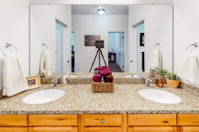 Two sinks vanity towels and decor Bathroom at Alpine Village in Provo Student Accommodation