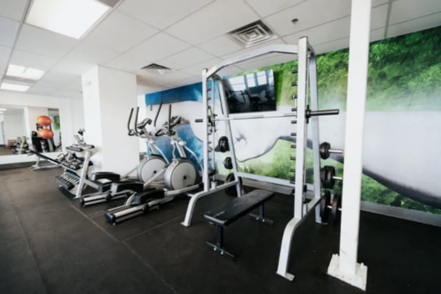 Ellipticals weight bench smith machine gym equipment gym at Alpine Village in Provo Student Accommodation