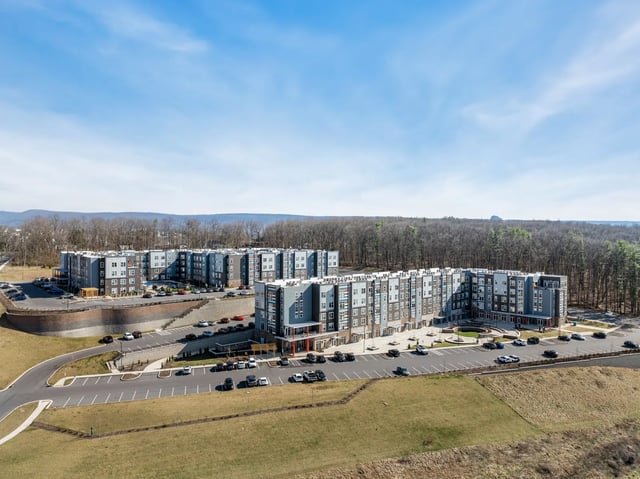 Modern apartment buildings with parking lots exterior at Aspen State College in State College Student Accommodation