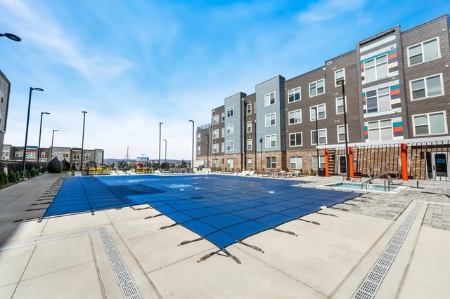 Covered swimming pool and apartment exterior exterior at Aspen State College in State College Student Accommodation