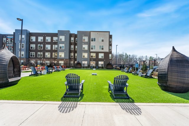 Chairs and seating pods on lawn exterior at Aspen State College in State College Student Accommodation