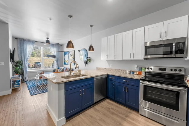 Island sink dishwasher oven and cabinets kitchen at Aspen State College in State College Student Accommodation