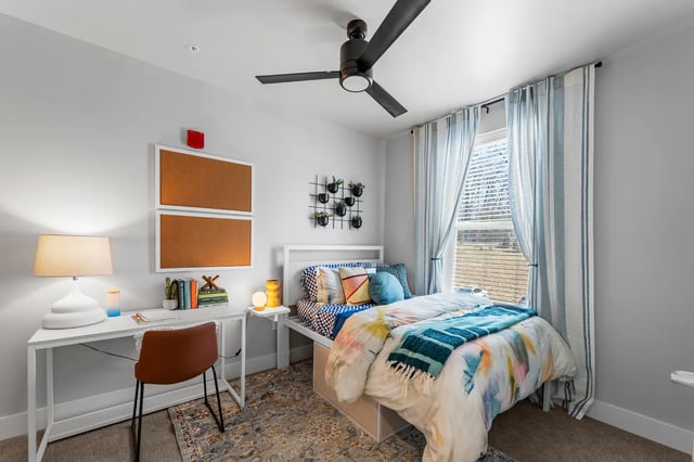 Bed desk corkboards with lamp and chair bedroom at Aspen State College in State College Student Accommodation