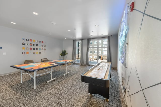 Ping pong table and shuffleboard game room at Aspen State College in State College Student Accommodation