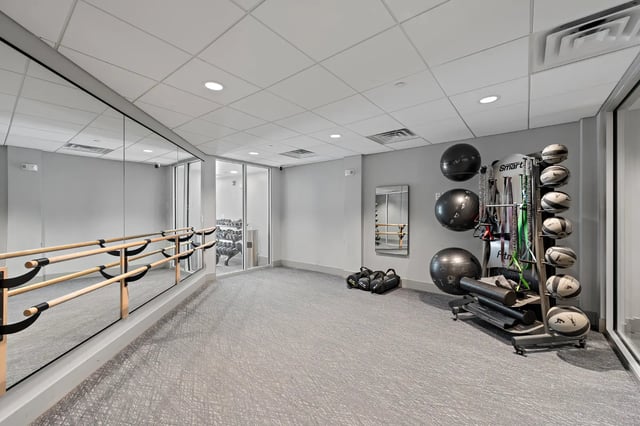 Barre weights mirrors and gym equipment gym at Aspen State College in State College Student Accommodation