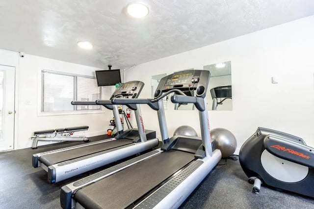 Treadmills weight bench and exercise equipment gym at Birch Plaza and Birchwood Apartments in Rexburg Student Accommodation