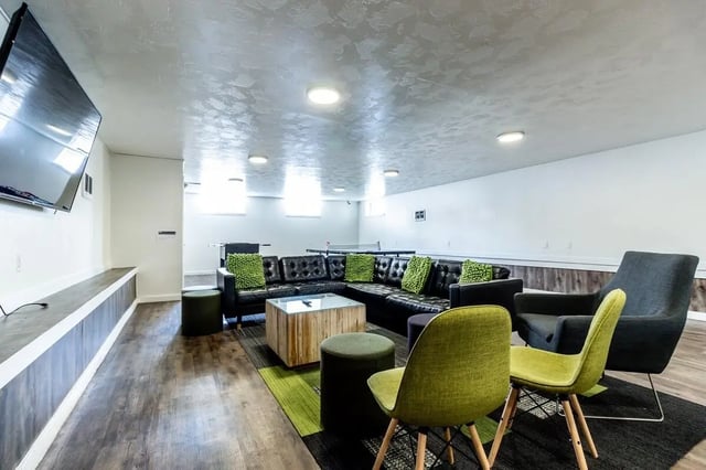 Sectional sofa table and chairs living room at Birch Plaza and Birchwood Apartments in Rexburg Student Accommodation