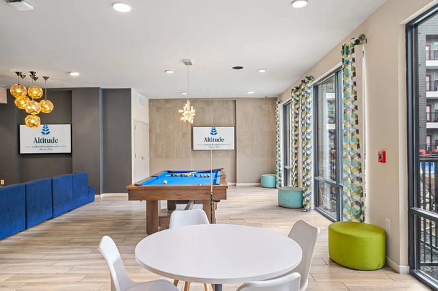 Altitude communal area with pool table and seating area at Altitude Apartments in Houston Student Accommodation