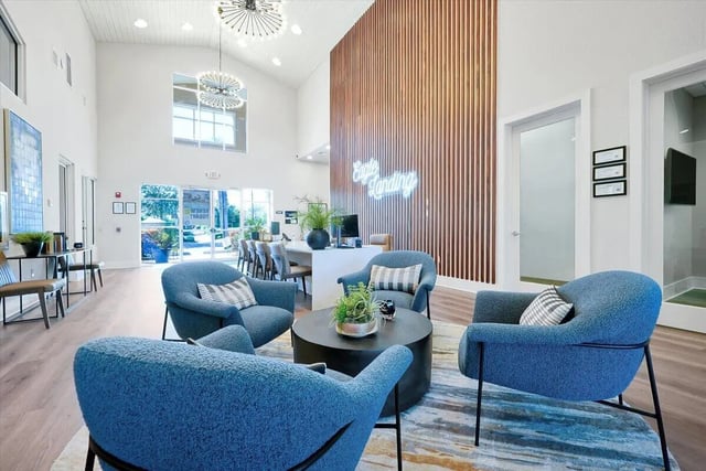 Blue armchairs and coffee table lounge living room at Eagle Landing in Daytona Beach Student Accommodation