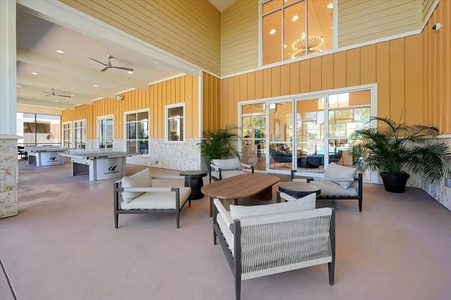 Outdoor seating and ping pong tables communal area at Eagle Landing in Daytona Beach Student Accommodation