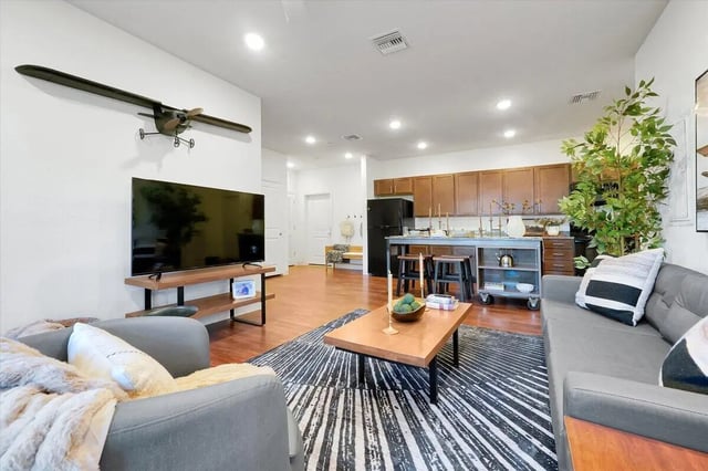 Airplane model TV couch coffee table kitchen living room at Eagle Landing in Daytona Beach Student Accommodation
