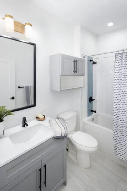 Vanity sink toilet bathtub shower curtain bathroom at Prospect Row in Tallahassee Student Accommodation