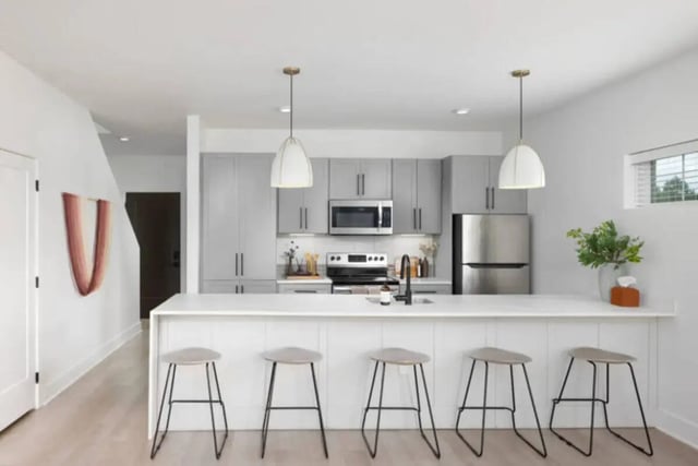 Modern kitchen with island and stools kitchen at Prospect Row North in Tallahassee Student Accommodation
