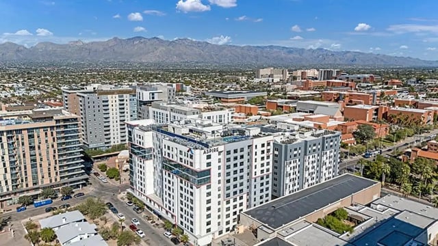 Modern apartment buildings with balconies near mountains exterior at Aspire Tucson Apartments in Tucson Student Accommodation